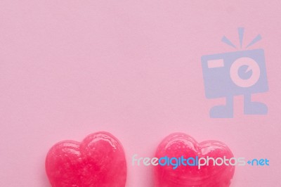 Two Pink Valentine's Day Heart Shape Lollipop Candy On Empty Pastel Pink Paper Background. Love Concept. Top View. Minimalism Colorful Hipster Style Stock Photo