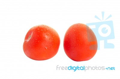 Two Red Isolated Tomatoes With Water Drops Stock Photo