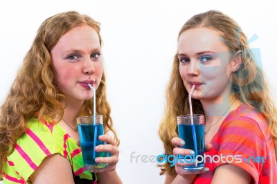 Two Teenagers Drink Blue Soda Stock Photo