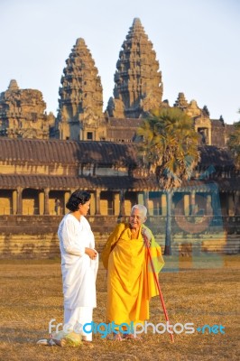 Two Unidentified Buddhist Female Monks Dressed In Orange And Whi… Stock Photo