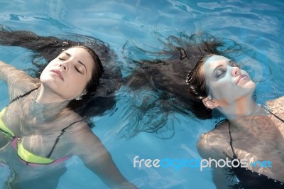 Two Women In The Pool Stock Photo