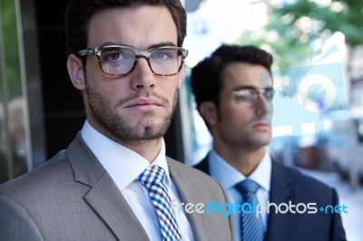 Two Young Executives Arriving At The Hotel Stock Photo