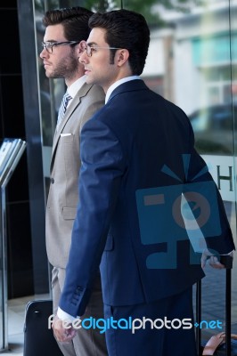 Two Young Executives Arriving At The Hotel Stock Photo