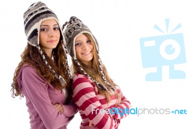 Two Young Friends Wearing Woolen Cap And Looking At Camera Stock Photo