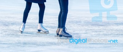 Two Young Girls Are Skating On The Rink Stock Photo