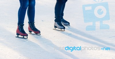 Two Young Girls Are Skating On The Rink Stock Photo