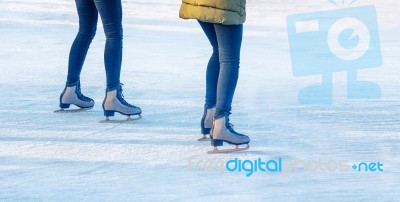 Two Young Girls Are Skating On The Rink Stock Photo