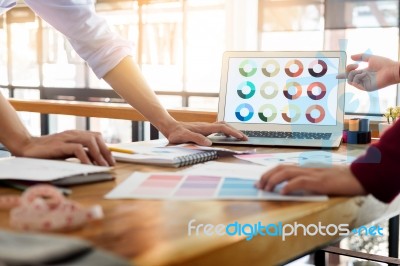 Two Young Men Working As Fashion Designers And Drawing Sketches Stock Photo