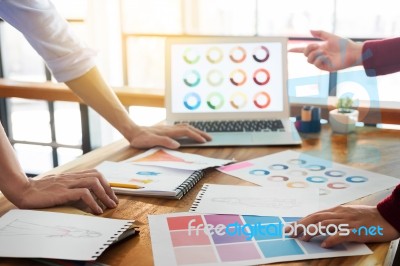 Two Young Men Working As Fashion Designers And Drawing Sketches Stock Photo