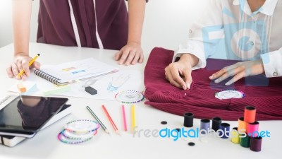 Two Young Women Working As Fashion Designers And Drawing Sketche… Stock Photo