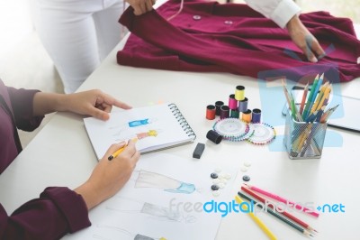 Two Young Women Working As Fashion Designers And Drawing Sketche… Stock Photo