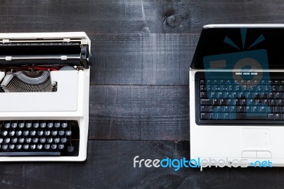 Typewriter And Computer Laptop On Wooden Background Retro Stock Photo