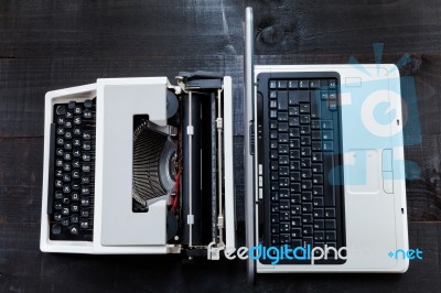 Typewriter And Computer Laptop On Wooden Background Retro Stock Photo