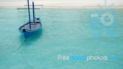 Typical Maldivian Boat On Blue Ocean Stock Photo