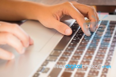 Typing On Keyboard Laptop At Work Table Stock Photo