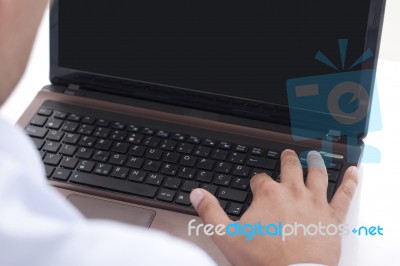 Typing On The Laptop Stock Photo