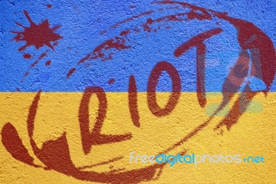 Ukraine Flag Painted On Old Concrete Wall With Riot Inscription Stock Photo