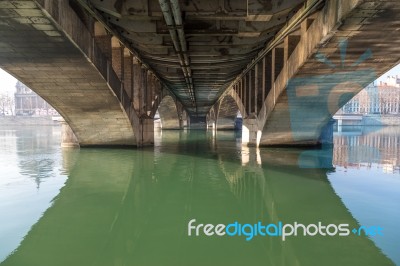 Under A Bridge With A River Stock Photo