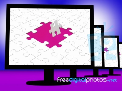 Unfinished Puzzle On Monitors Showing Completion Stock Image