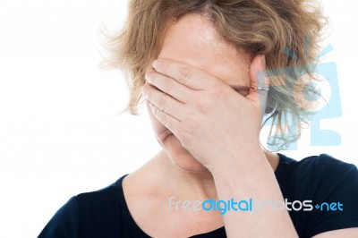 Unhappy Woman Hiding Her Face Stock Photo