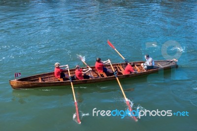 Unidentified Man And Boys Exhausted At The End Of A Rowing Boat Stock Photo