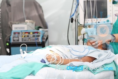 Unidentified Patient Receiving Oxygen By A Breathing Mask Holded… Stock Photo