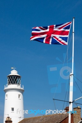 Union Jack Flag Flying Near The Lighthouse In Southwold Stock Photo