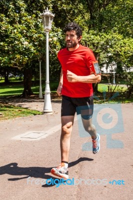 Urban Athlete Running On The Park Stock Photo