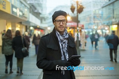 Urban Man Holdin Tablet Computer On Street Stock Photo