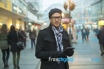 Urban Man Holdin Tablet Computer On Street Stock Photo