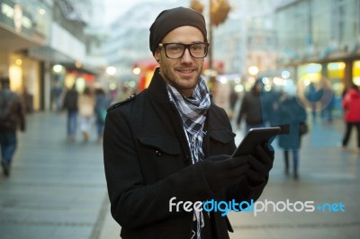 Urban Man Holdin Tablet Computer On Street Stock Photo