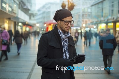 Urban Man Holdin Tablet Computer On Street Stock Photo