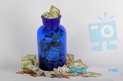 USA Money In Blue Jar Stock Photo