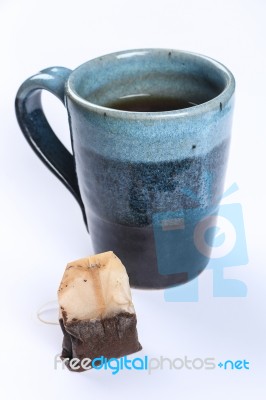 Used Tea Bag With Tea Cup Stock Photo