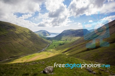 Valley With A Lake And Hills Stock Photo