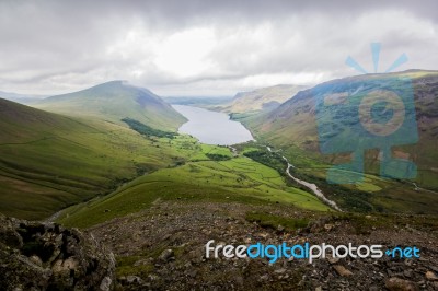 Valley With A Lake And Hills Stock Photo