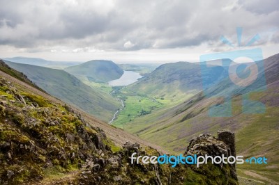 Valley With A Lake And Hills Stock Photo