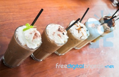 Variety Iced Coffee Drinks On Wooden Table Stock Photo