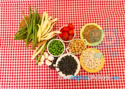 Variety Of Kitchen Ingredients With Fresh And Dried Legumes Stock Photo