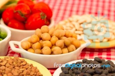 Variety Of Kitchen Ingredients With Fresh And Dried Legumes Stock Photo