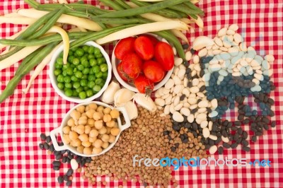 Variety Of Kitchen Ingredients With Fresh And Dried Legumes Stock Photo