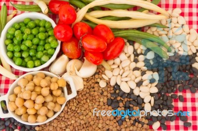 Variety Of Kitchen Ingredients With Fresh And Dried Legumes Stock Photo