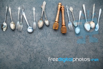 Various Cooking Utensils Border. Spoons And Fork On Dark Stone B… Stock Photo