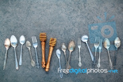 Various Cooking Utensils Border. Spoons And Fork On Dark Stone B… Stock Photo