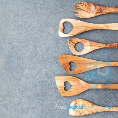 Various Wooden Cooking Utensils Border. Wooden Spoons And Wooden… Stock Photo