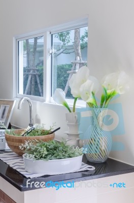 Vase Of Flower On Counter In Kitchen Room Stock Photo