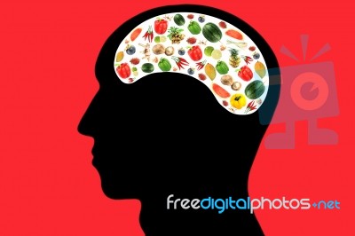 Vegetables And Fruits In Head On Red Background Stock Photo