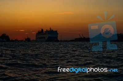 Venice Italy Sunset With Cruise Boat Stock Photo