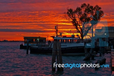 Venice Italy Sunset With Cruise Boat Stock Photo