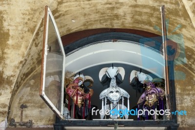 Ventian Masks In A Window In Venice Stock Photo